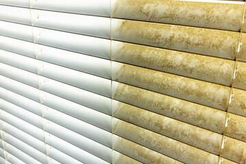 Residential Window Shades Showing the Before and After of a Good Cleaning - One Side Clean and One Side Dirty.