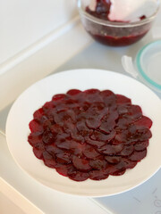 An Exquisite and Deliciously Layered Presentation of Beetroot Carpaccio Appetizer