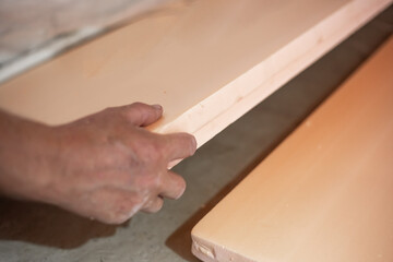 Laying polystyrene foam on the floor. Thermal insulation of the floor surface in the house with environmentally friendly safe slabs