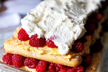 raspberry cream cake topped with vibrant berries