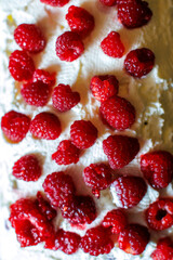 Delightful dessert topped with fresh raspberries on a creamy layer