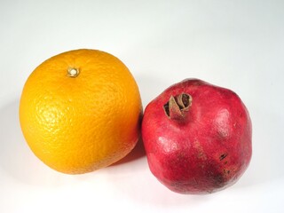 Orange and Pomegranate on White Background