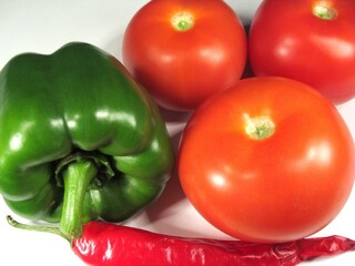 Fresh Vegetables: Green Bell Pepper, Tomatoes, and Red Chili Pepper