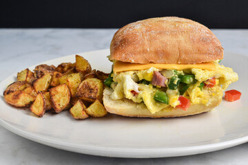 scramble egg with peppers onions and ham  on ciabatta