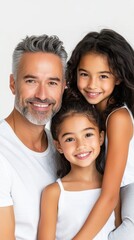 Fototapeta premium A joyful mixed-race father with silver hair embraces his two happy daughters, showcasing love and family connection.