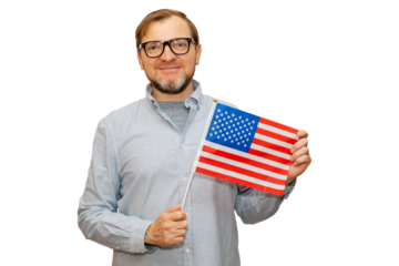 Smiling mature man holding in hand flag of united states of america. Middle aged man in glasses and wearing shirt with USA flag, independence day US. Studio shot isolated on white background.