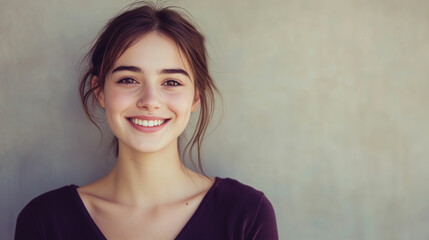 Fototapeta premium A young European woman with a warm smile in a casual setting during the afternoon