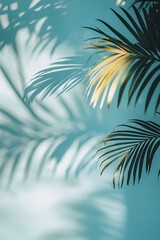 Blurred shadow from palm leaves on a light blue wall, forming an abstract background for product showcasing.