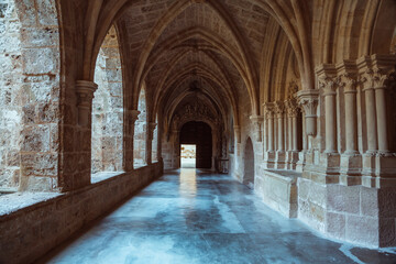 Obraz premium Serene Stone Archways of an Ancient Monastery Corridor