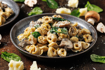 Chestnut Mushrooms and spinach tortellini served with parmesan cheese