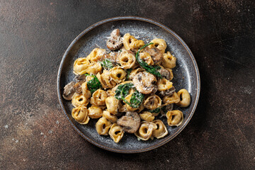 Chestnut Mushrooms and spinach tortellini served with parmesan cheese