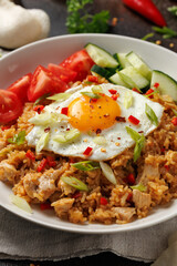 Nasi goreng, fried rice with chicken and egg in Indonesia style. Asian food