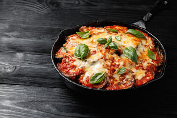 Traditional homemade Aubergine parmigiana with tomato sauce parmesan and mozzarella cheese