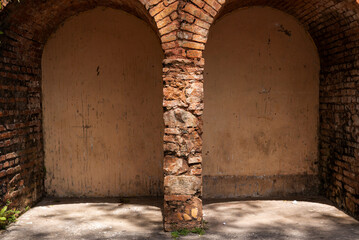 View of a conglomerate-style brick wall in the shape of an arch in Pelourinho, the historic center...