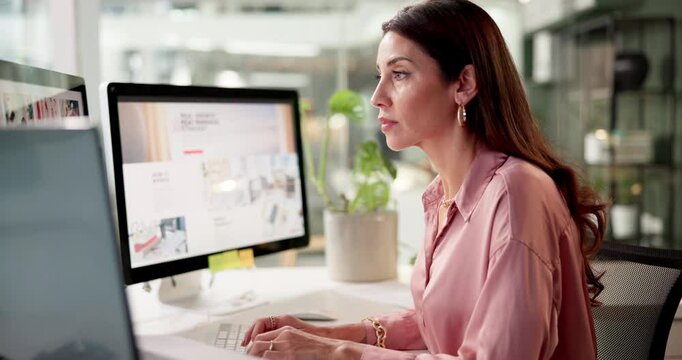 Computer, creative and typing with business woman at desk in office for administration or report. Interior design, magazine website and research with editor or online publisher employee in workplace