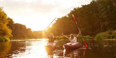 Experience the Joyful Paddling Adventures at Sunset while enjoying the Serene Water