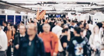Abstract blurred people at exhibition hall of expo event trade show. Business convention show or...