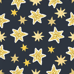 Hand drawn seamless pattern with glitter stars.Festive background with texture elements.Yellow objects on dark blue.Colorful print on fabric and paper.Vector design for textile,endless wallpaper.
