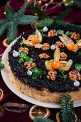 Napoleon cake on a fir background. Christmas cake. Napoleon cake for Christmas dinner