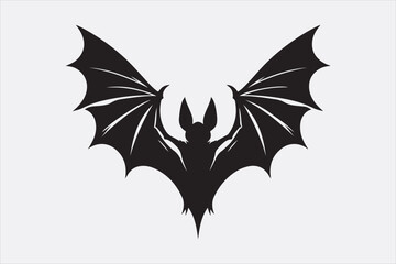 A black silhouette of a flying bat with outstretched wings.