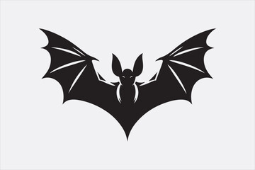 A black silhouette of a flying bat with outstretched wings.