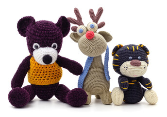 Knitted deer tiger and bear.