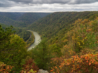Turkey Spur Rock and Grandview Rim with fall-colored mountains at New River Gorge National Park, West Virginia