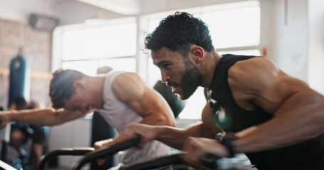 Gym, breathing and men with cycling for fitness, muscle development and stability with endurance.Team, friends and workout with bike machine for joint mobility, wellness or cardio exercise for health