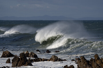 Huge waves in South Africa. Beach in False Bay. Stormy ocean during winter.