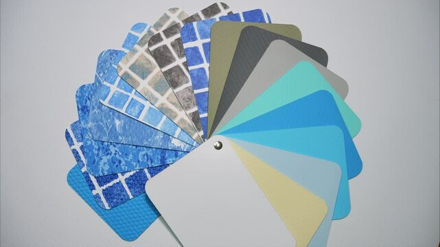 A palette of pool cover samples. Stop motion. PVC liner swatches