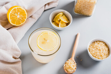Trendy rice and lemon drink to reduce appetite in a glass on the table