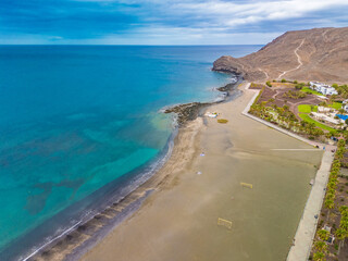 Aerial drone view of Las Playitas fishing town and the beach, Fuerteventura, Canary Islands
