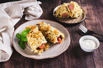 Cabbage rolls with sausages on a plate on the table