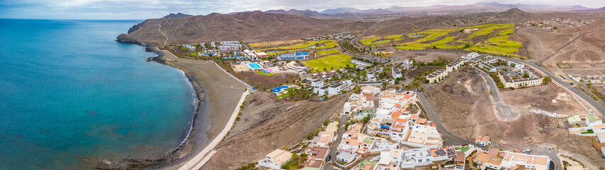 Obraz premium Aerial drone view of Las Playitas fishing town and the beach, Fuerteventura, Canary Islands