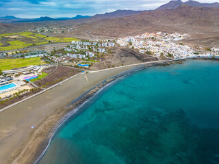 Aerial drone view of Las Playitas fishing town and the beach, Fuerteventura, Canary Islands