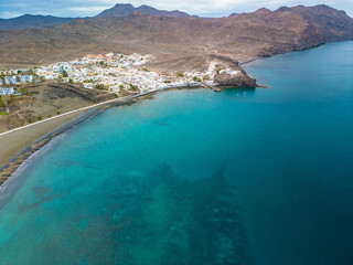 Obraz premium Aerial drone view of Las Playitas fishing town and the beach, Fuerteventura, Canary Islands