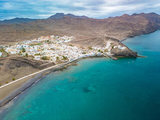 Obraz premium Aerial drone view of Las Playitas fishing town and the beach, Fuerteventura, Canary Islands