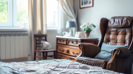 Obraz premium Modern bedroom with a classic touch, featuring a large window, plush chair, and wooden furniture.