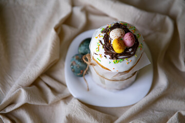 Delicious Easter kulich on a light background, showcasing homemade baking with a touch of warmth and coziness. Perfect for celebrating traditions and festive gatherings.