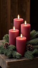 candles are placed on an old wooden table, surrounded by green pine branches, creating a warm ambiance for Christmas