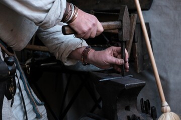 Forge. Working with red-hot metal. Medieval craftsmanship. 
