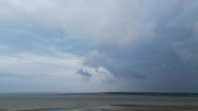 Beautiful High Angle Footage of Beach and Ocean Sea Side at Point Clear Village in Civil Parish of Saint Osyth, County of Essex, England, United Kingdom During Windy and Cloudy Day. May 22nd, 2024