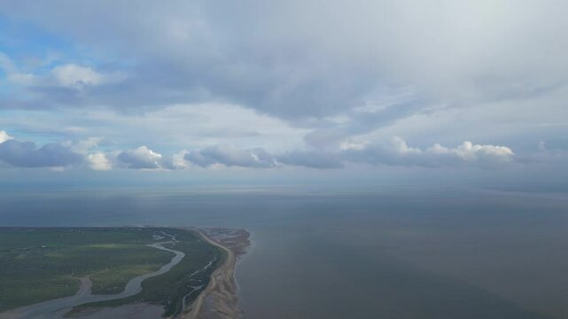 Beautiful High Angle Footage of Beach and Ocean Sea Side at Point Clear Village in Civil Parish of Saint Osyth, County of Essex, England, United Kingdom During Windy and Cloudy Day. May 22nd, 2024