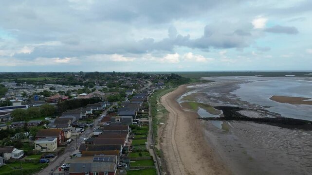 Beautiful High Angle Footage of Beach and Ocean Sea Side at Point Clear Village in Civil Parish of Saint Osyth, County of Essex, England, United Kingdom During Windy and Cloudy Day. May 22nd, 2024