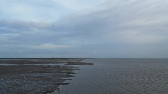 Beautiful High Angle Footage of Beach and Ocean Sea Side at Point Clear Village in Civil Parish of Saint Osyth, County of Essex, England, United Kingdom During Windy and Cloudy Day. May 22nd, 2024