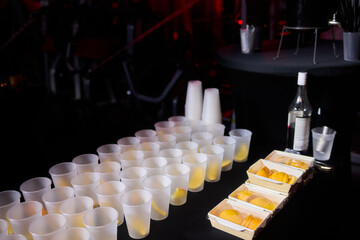 An Array of Frosted Plastic Cups Set on a Table in a Stylish Fashion for Events and Gatherings