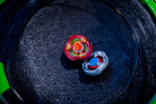 Beyblade battle of spinning toys in a fight of a Japanese origin game