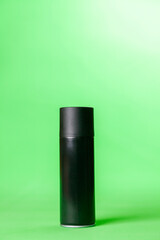 Black spray can on green background. mockup. Can concept. Mockup concept. copy space.