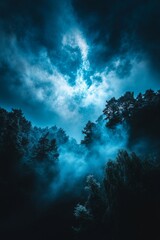 Obraz premium The Wetterstein - a winter landscape featuring snow-covered mountains, forests, and dramatic fog