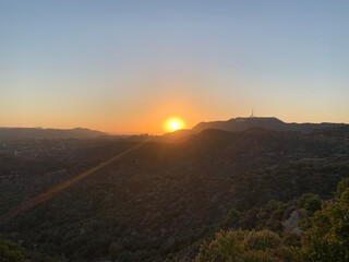 During the golden hour in the Hollywood Hills, the sunset paints the sky with a stunning colors....